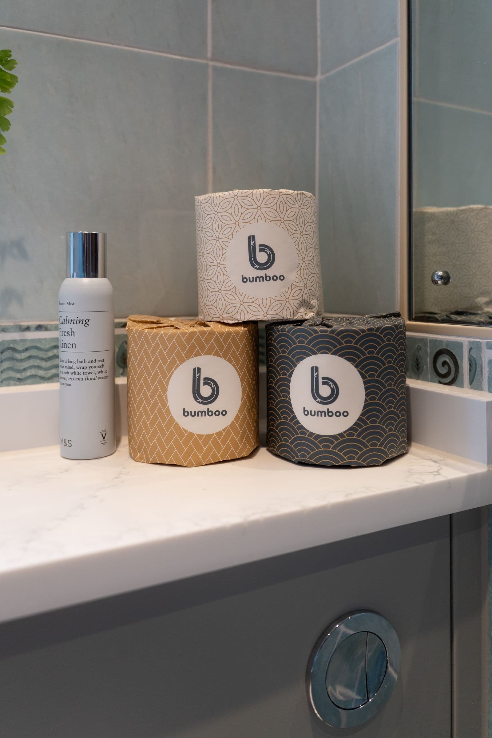 Bamboo rolls and toiletries on the bathroom counter.