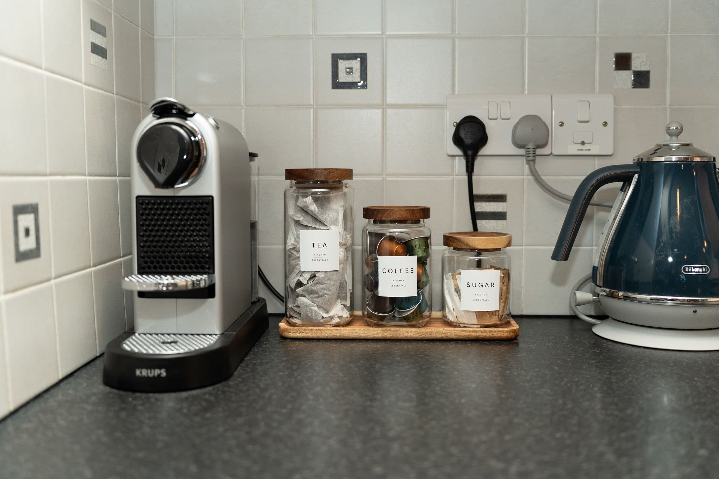 The coffee station — Nespresso machine, kettle and jars of tea, coffee and sugar.