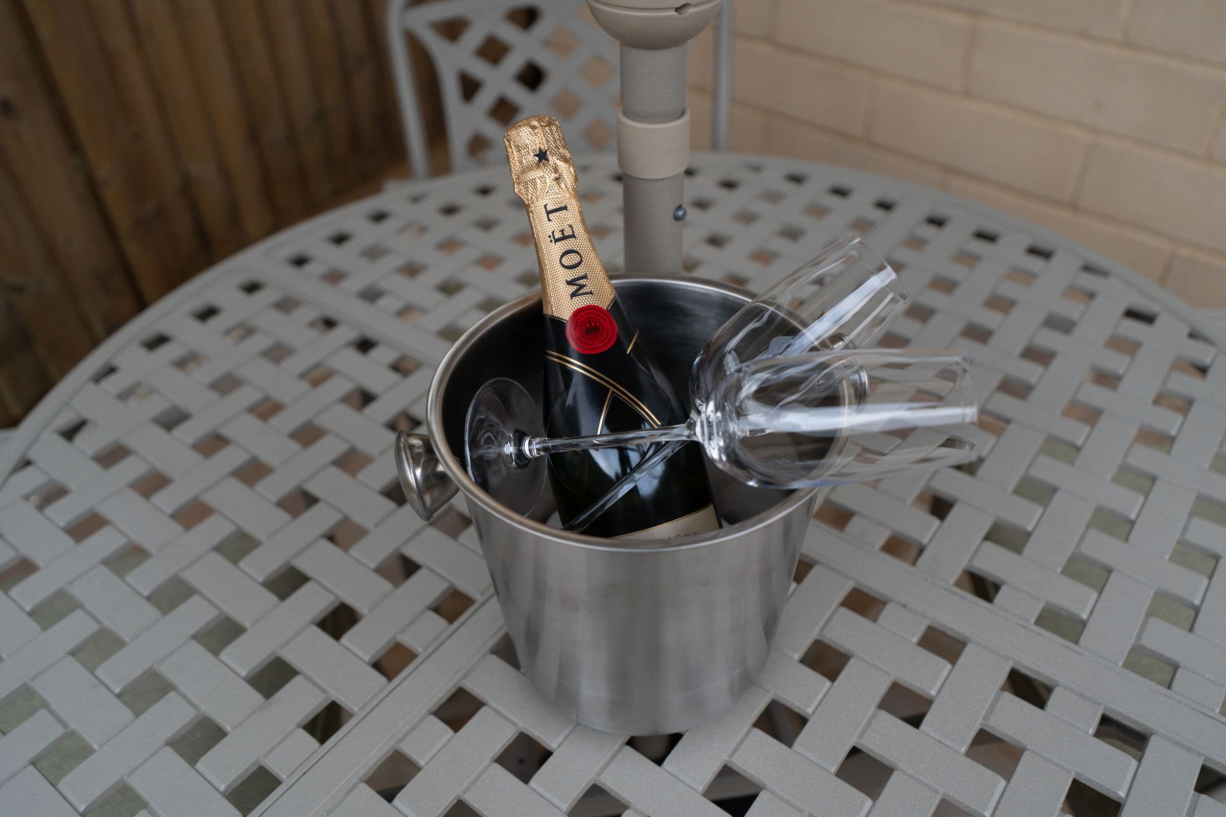 Champagne on ice on the garden table.