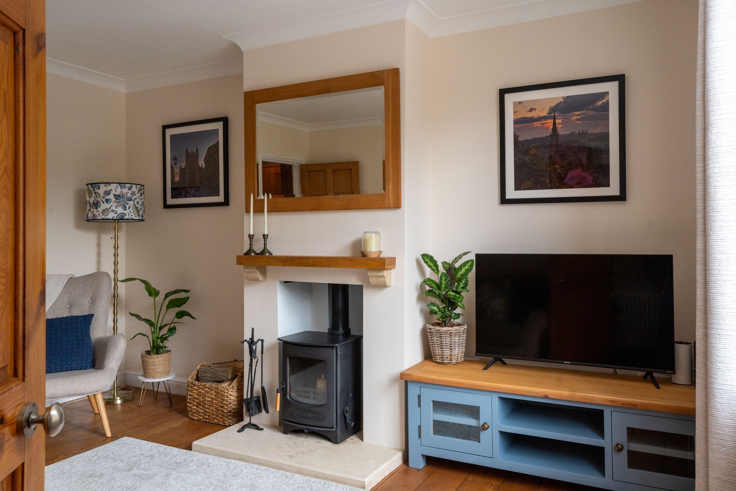 The living room, with the wood burner in the chimney breast and the television alongside.